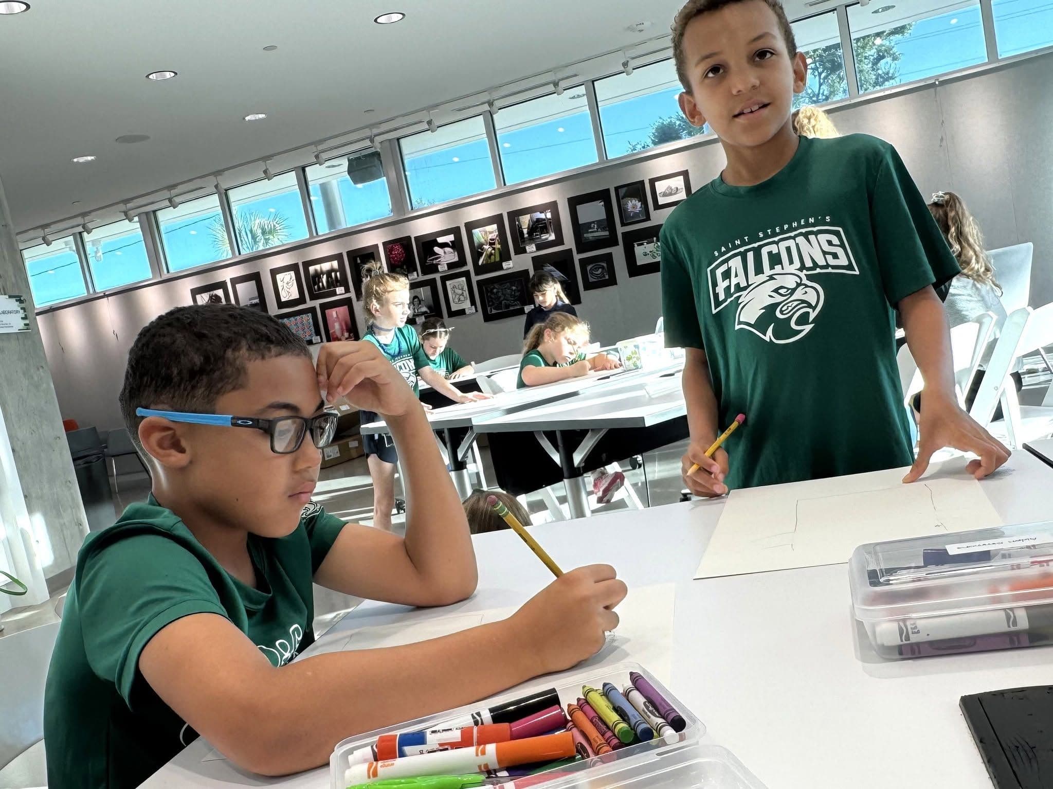 Lower School students smile together in their classroom.