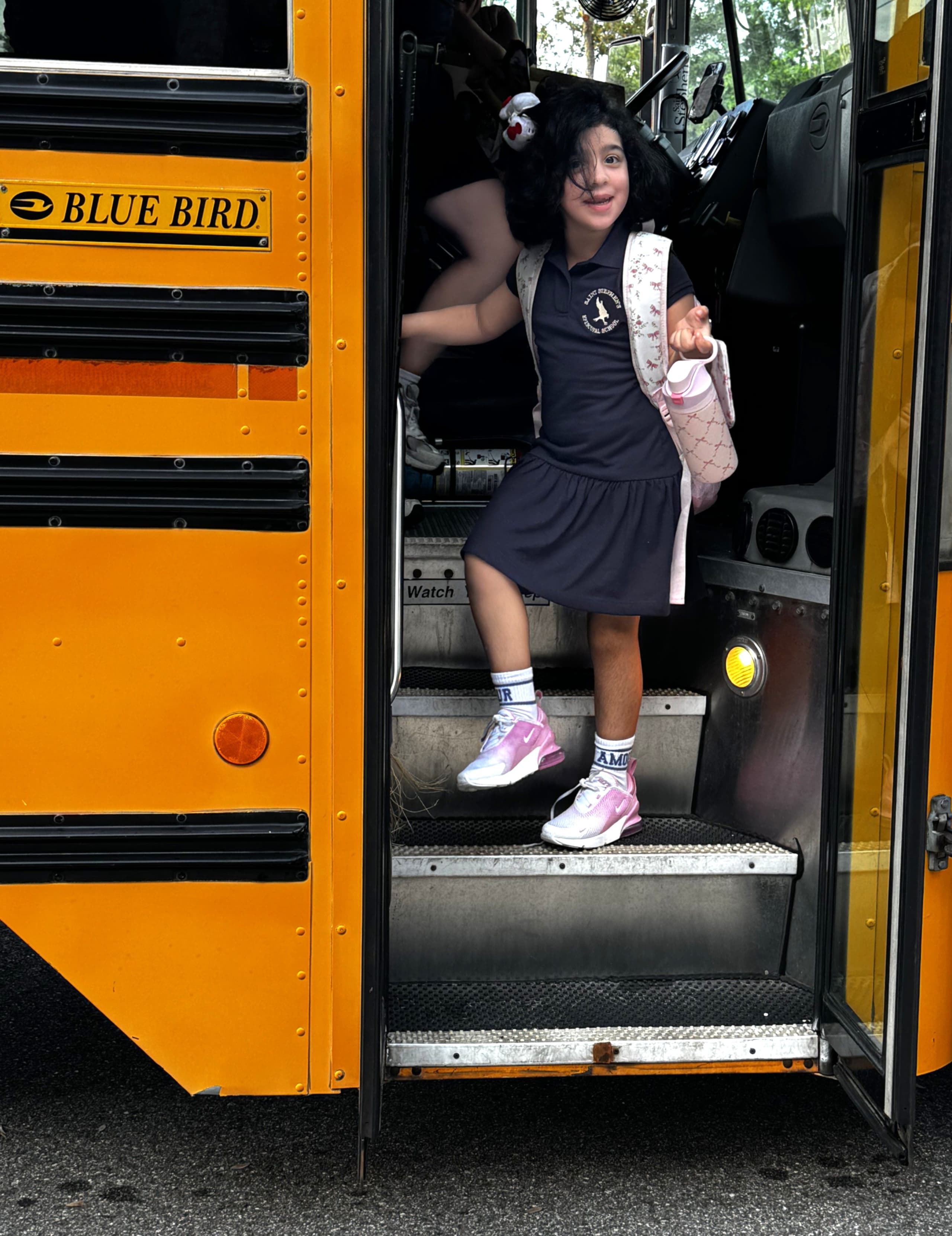 Student exits school bus