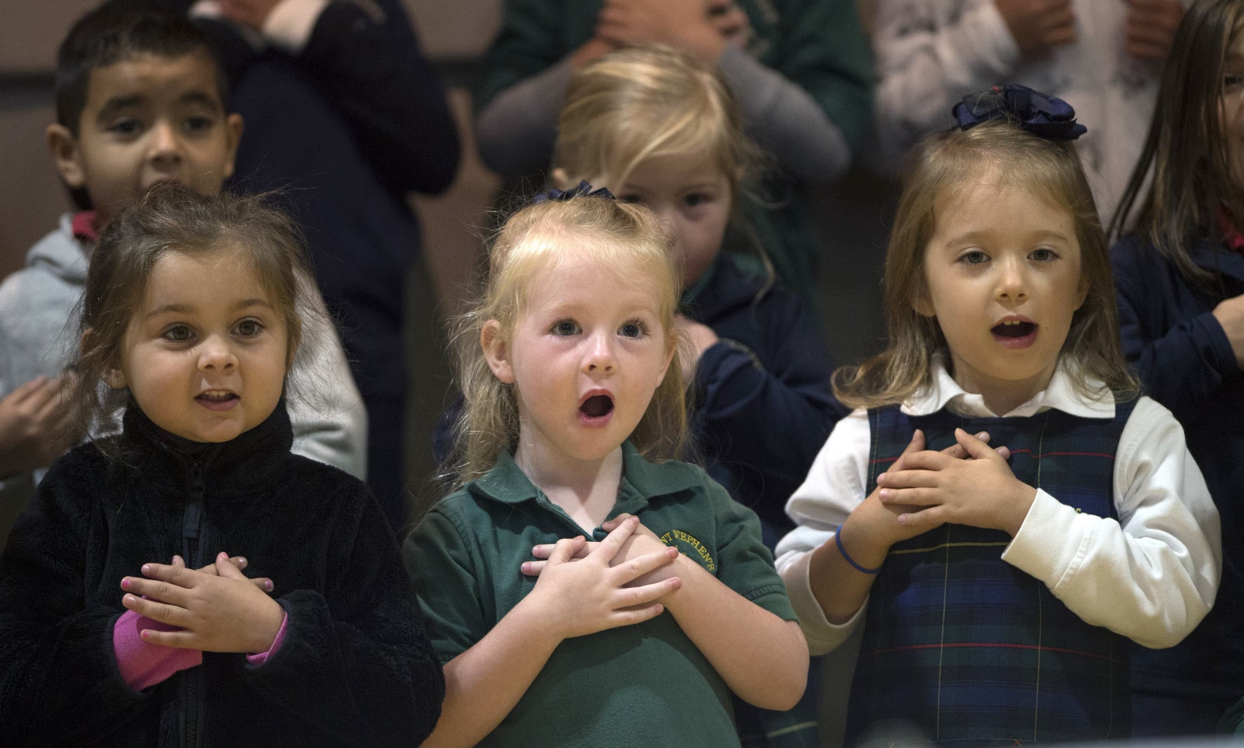 Students singing in a chapel service